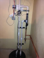 Vertical mount tied into existing discharge pipe